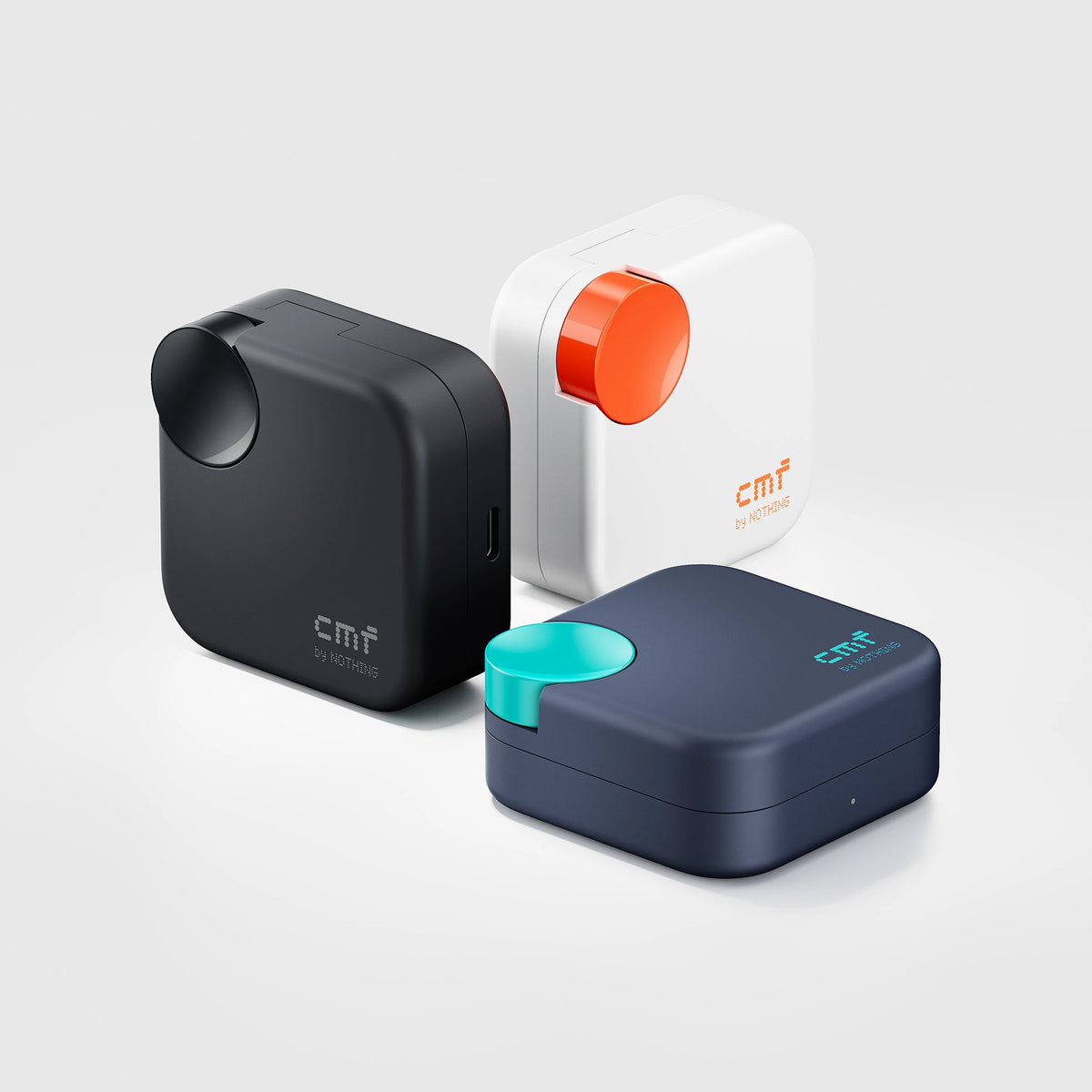 CMF Buds Neo charging cases in Black, White and Dark Blue side by side