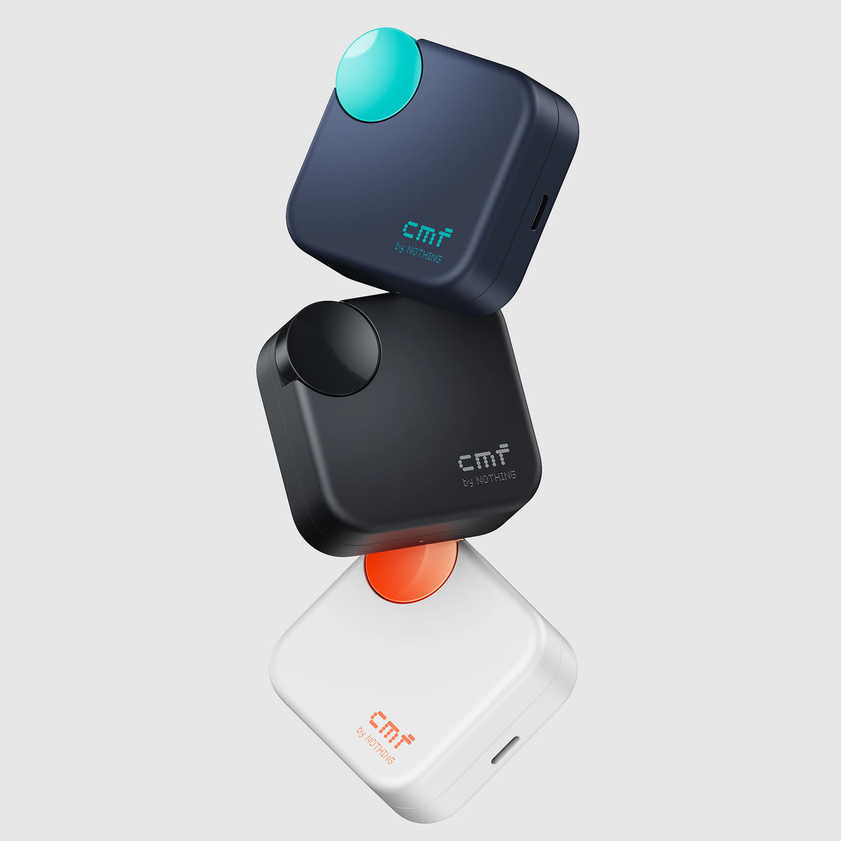 CMF Buds Neo charging cases in Dark Blue, Black and White in a floating arrangement